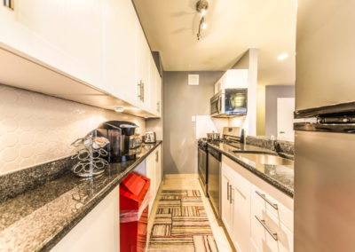 Spacious kitchen with stainless steel appliances and granite countertops in Rittenhouse Square apartments