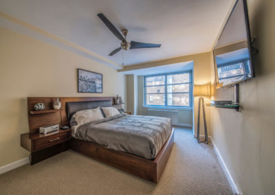 Furnished master bedroom in Rittenhouse Claridge apartment