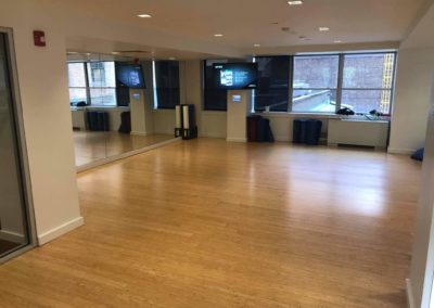 Fitness studio with mirrored walls and yoga mats for Rittenhouse Claridge residents to use in Philadelphia, PA