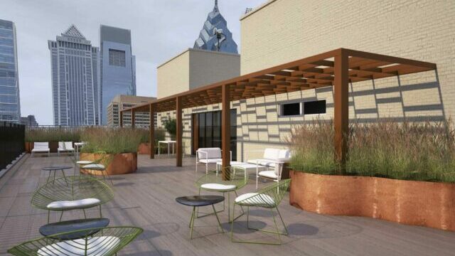 Rooftop lounge showing potted plants and lounge chairs